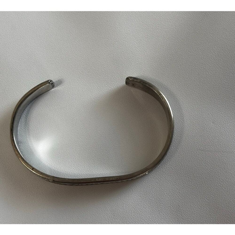 Silver open cuff bracelet with herringbone and braided rope pattern